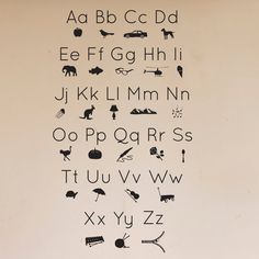 the letters and numbers are written in black on a white background with an animal theme