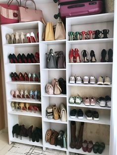 a closet filled with lots of shoes and purses