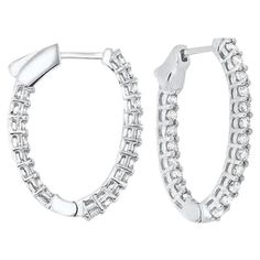 Nothing says luxury like an incredible pair of diamond hoop earrings. These stunning brightly polished 14 karat white gold inside out round-shaped hoop earrings feature a total of 46 round brilliant cut diamonds totaling 7.00 carats are prong set on the outside front and inside, creating a double dose of incredible scintillation and fire. Hinges on the bottom and click top posts secure these glamorous hoop earrings that are perfect for any occasion. Diamond color is I/J and clarity is I1. Inside Outside, Diamond Hoop Earrings, Jewelry Earrings Hoops, Round Brilliant Cut Diamond, 1 Carat, Diamond White, Prong Setting, Colored Diamonds, Silver Bracelet