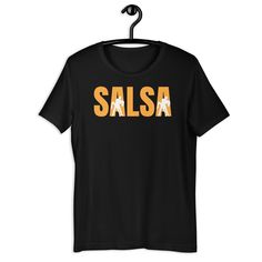 Description: Show off your love for salsa with our Salsa T-Shirt, designed for passionate dancers and salsa enthusiasts. Whether you're hitting the dance floor or staying active at the gym, this versatile tee is perfect for every salsa lover who wants to combine style with comfort. For Sizing Please Ignore The US Letter Words.  Features: Design: A chic and dynamic design that celebrates the energy and rhythm of salsa dancing, making it a standout piece for any dancer. Material: Made from 100% hi Fitted Crew Neck T-shirt For Dance, Fitted T-shirt For Summer Dance, Salsa Dancer, Dance Instructor, Staying Active, Gym Shirt, Salsa Dancing, Dynamic Design, Dance Practice