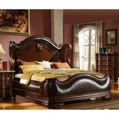 a bedroom with a bed, dresser and two nightstands in brown wood finish colors