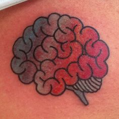 a drawing of a brain on the back of a woman's shoulder