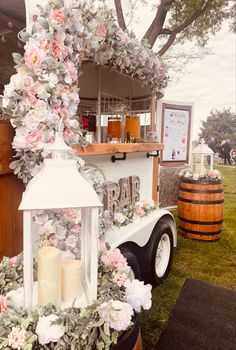 a food truck decorated with flowers and candles