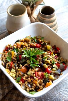 a white bowl filled with food on top of a table