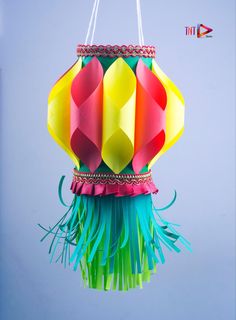 a colorful paper lantern hanging from a string