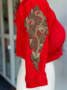 This red designer blouse is perfect for special occasions. Embroidered with intricate details, it's designed to add a touch of elegance to your ensemble. Perfect for pairing with a saree, it's sure to become an instant favorite. size 38-42 Red Designer Blouse, Blouse Saree, Designer Blouse, Designer Blouses, Choker Necklaces, Saree Blouse, Intricate Details, Choker, Special Occasion