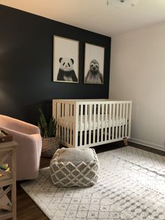 a baby's room with two panda pictures on the wall and a white crib