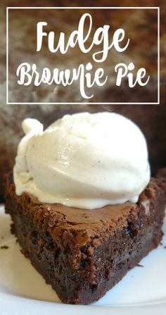 a piece of fudge brownie pie on a plate with whipped cream in the middle