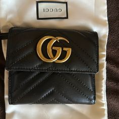 Gucci Marmont Leather Wallet Good Condition Designer Gucci Wallets With Gold-tone Hardware, Classic Gucci Wallet With Gold-tone Hardware, Classic Gucci Wallets With Gold-tone Hardware, Designer Gucci Bags With Card Slots, Gucci Bifold Evening Wallet, Designer Black Wallet With Gold-tone Hardware, Designer Black Leather Coin Purse, Elegant Gucci Bifold Bag, Designer Black Wallets With Gold-tone Hardware