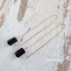 Raw Black tourmaline earrings 18k gold plated filled long threader chain matt black earrings raw stone    Earrings 18k gold plated brass.Tourmaline drop : 1.5 cm - 9/16 inTotal earring length: 15.5 cm - 6 1/8 in  (threaders: chain 9cm - 3 9/16 , stick 4.5 cm - 1 3/4 in).Price is for the pair of earrings.Black tourmaline (faceted) threader earrings:https://www.etsy.com/listing/643485714/black-tourmaline-earrings-18k-gold?ref=shop_home_active_1Garnet threader earrings:https://www.etsy.com/listing/ Elegant Tourmaline Dangle Earrings, Yellow Gold Tourmaline Dangle Earrings, Black Natural Stone Dangle Earrings, Black Tourmaline Earrings, Black Tourmaline Necklace, Raw Stone Earring, Gold Chain Earrings, Long Gold Earrings, Raw Black Tourmaline