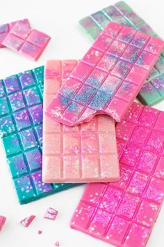 pink and blue candy bars with glitter on them