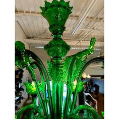 a green glass chandelier in a store