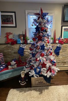 a patriotic christmas tree with red, white and blue decorations