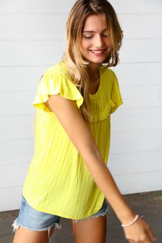 Accentuate your charm with this yoke top designed with a round neck, frill details across the chest and ruffle sleeves. This top has a flattering drape and is perfect for warm weather. Wide Rib + Yoke Style + Ruffles & Frills Soft & Stretchy 95% RAYON 5% SPANDEX Designed in California Imported Runs True to Size Weight: .4 Lbs; Plus .5 Lbs. Bust (side seam to side seam): S 18" M 19" L 20" 1X 22" 2X 23" 3X 24" Length (shoulder to hem): S 24" M 24.5" L 25" 1X 26" 2X 26.5" 3X 27" Regular Model Measurements: 5' 7", Size Small, Chest 32", Waist 26", Hips 33" Plus Model Measurements: 5' 6", Size 2X, Chest 52," Waist 48," Hips 57" Frill Shorts, Yoke Top, Farm Clothes, Kids Activewear, Denim Short Dresses, Denim Blouse, Ruffle Sleeves, Sweater And Shorts, Hat Hairstyles