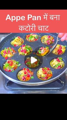 an appetizer pan filled with different types of food on top of a metal tray