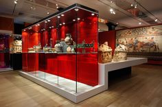 an exhibit with vases and other items on display