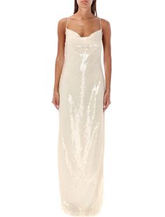 This exquisite cream-colored 24 long dress by Magda Butrym features a luxurious sequin finish that beautifully catches the light. Designed with a cowl neckline, delicate spaghetti straps, and crisscross back detailing, it ensures a glamorous look for special events. 

- Model height: 1.72m  
- Size worn: 36  
- Material: 100% Polyamide Sequin Long Dress, Maxi Design, Magda Butrym, Sequin Maxi Dress, Hand Woven Textiles, Sequin Maxi, Pleats Please Issey Miyake, Cowl Neckline, Sequin Fabric