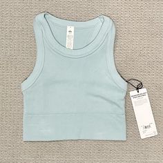 New With Tags! - Chalk Blue (Baby Blue) - Size Small - See Photos For Item Detail. Model Is Wearing White Color, Im Selling A Blue Color Alo Yoga Fitted Everyday Tops, Alo Yoga Fitted Tops For Everyday, Basic Blue Activewear For Gym, Alo Yoga Seamless Athleisure Tops, Alo Yoga Seamless Workout Top, Blue Seamless Tank Top With Medium Support, Blue Tank Top With Seamless Construction And Medium Support, Casual Seamless Tops By Alo Yoga, Alo Yoga Seamless Tops For Spring