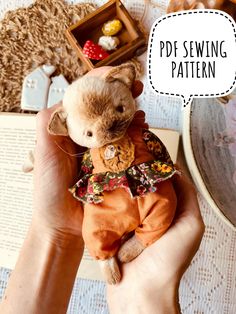 a person holding a small stuffed animal in their hands with the caption pee sewing pattern