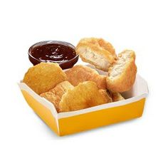 a box filled with pastries and dipping sauce