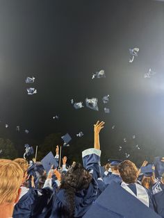 graduates throwing their caps in the air