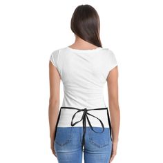 a woman wearing jeans and a white shirt with a black tie around the waist, back view