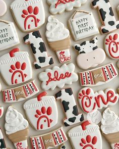 decorated cookies are arranged in the shape of farm animals