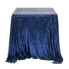 a blue sequin tablecloth on a white background