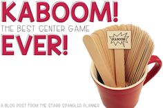 a red cup filled with wooden spoons next to a sign that says kaboom the best center game ever