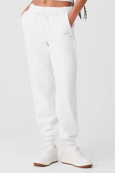 Perfect for lounging yet street-ready, the Accolade Sweatpant in white is essential for any lazy day look. With an elastic waist and cuffs for comfort and a relaxed unisex fit that pairs well with the matching hoodie or crew, you'll want to live in these ultra-soft french terry pants. Unfussy yet stylish, they allow you to drift from your couch to coffee run without compromising on cozy or cool factors. Spring Basic Relaxed Fit Joggers, Casual Alo Yoga Activewear Long Pants, Alo Yoga Sporty Relaxed Fit Joggers, Casual Alo Yoga Activewear With Ribbed Waistband, Alo Yoga Casual Long Pants Activewear, Alo Yoga Sporty Cotton Sweatpants, Basic Spring Joggers With Elastic Waistband, Alo Yoga Cotton Sporty Sweatpants, Casual Alo Yoga Sweatpants With Ribbed Waistband