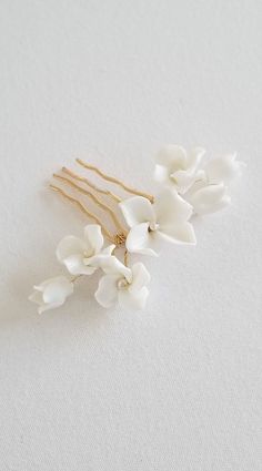 "Floral Porcelain Wedding Hair Comb A beautiful simple hand crafted small bridal comb made with porcelain flowers and freshwater pearls. The flowers can gently be moved around to shape it to work with different types of styled wedding hair. Additional bobby pins should be used on this piece for extra security while being worn. These porcelain flowers are very delicate and care must be taken to not break them. Suitable for upscale, modern, garden or beach weddings. Other comb options available by Small Floral Wedding, Pearl Bridal Comb, Porcelain Wedding, Flower Bridal Hair, Floral Wedding Hair, Prom Hair Accessories, Polymer Clay Flower Jewelry, Wedding Hair Comb, Bridal Hairstyle