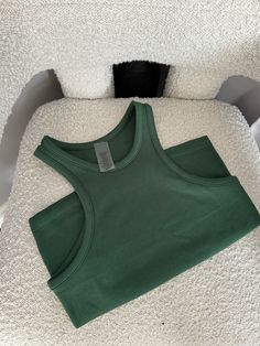 The seamless high neck tank has an on trend hick neck silhouette and soft smooth feel. 92% Nylon, 8% Spandex High Neck Tank, High Neck, Spandex, Green