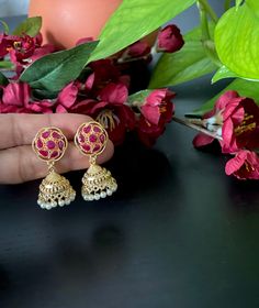 Beautiful small cute gold finished Ruby  jumkas  for your ethnic party wear dresses. Weight of this pair of earrings : 0.4 Oz. Product care: Avoid contact with Chemicals such as Perfumes or any Sprays. Prevent the Jewellery from the water. Use Butter Paper or Cotton Cloth to store your Jewellery for a longer Product life.