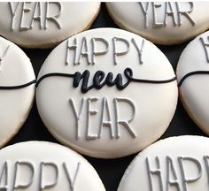 decorated cookies with happy new year written on them