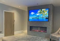 a large flat screen tv mounted to the side of a wall in a living room