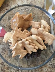 a glass bowl filled with cookies on top of a counter