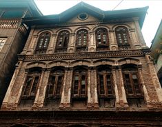 an old building with many windows and balconies