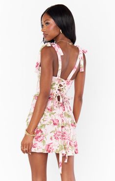 Get swept away by romance in the Lady Corset Mini. Beautiful tiers of pink florals fall to a mini hem topped with a figure flattering corset bodice that can be tightened as you please! Let her be the statement of your look paired with dainty jewelry and barely there heels. Garden Romantic, Corset Bodice, Corset Mini Dress, Hem Top, The Lady, Dainty Jewelry, Bodice, Romance, Mini Dress