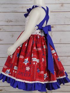 "USA America Stars & Stripes fabric Girls Halter Style Dress is perfect for all your 4th of July events. How Cute is this Style dress with a Lined bodice and Neck ruffle. Long Straps Cross in the Back and Tie into a Big Bow. Full Twirl Skirt with Star Border and Blue Ruffle Grow with Me style so it can be worn from Memorial Day to Labor Day Sizes available for Babies, Toddlers, Little Girls up to Teens Size 14 Handmade Made in the USA by me! -------------------------------------------------- Red Patriotic Dress For 4th Of July, Patriotic Red Dresses For 4th Of July, Patriotic Sleeveless Red Dress, 4th Of July Events, Girls Western Dresses, Star Border, July Events, 4th Of July Dresses, Pageant Wear