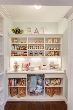 an organized pantry with lots of food in the cupboards and on the shelves is shown