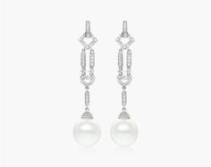 The 18K White Gold Diamond and Cultured South Sea Pearl Art Deco Drop Earrings are a beautiful and unique pair of earrings that are perfect for anyone looking for a stylish and elegant piece of jewelry. The earrings feature a pair of 11-12mm South Sea pearls that are set in a geometric Art Deco design. The pearls are surrounded by glistening diamonds that add a touch of luxury to the piece. The earrings are made of high-quality materials and are sure to last for years to come. The earrings are a Luxury Pearl Dangle Earrings For Formal Occasions, Luxury White Earrings For Evening, Luxury White Evening Earrings, Refined White Earrings For Formal Occasions, Refined White Earrings For Evening, Luxury White Drop Bridal Earrings, White Luxury Bridal Earrings For Pierced Ears, Art Deco Drop Earrings, Pearl Art