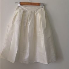 Knee Length Pleated White (Tint Of Ivory) A Line Skirt. Never Worn With Tag (Nwt) The Back Of The Skirt Is Elastic/Stretchy. Perfect For Work Or Baby Shower. Pleated White Skirt, Line Skirt, White Skirt, White Skirts, A Line Skirt, Beige Color, A Line Skirts, Knee Length, Womens Skirt