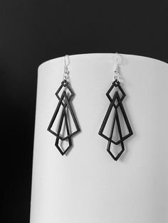 Canadian-made geometric style earrings. 3D printed and hand finished design. Lightweight materials feel easy on your ears while showcasing modern look for any occasion. Modern Geometric Pierced Earrings, Handmade Modern Geometric Earrings, Modern Handmade Geometric Earrings, Modern Geometric Ear Wire Earrings, Modern Black Geometric Earrings, Triangle Earrings, Geometric Earrings, Deathly Hallows Tattoo, Style Earrings