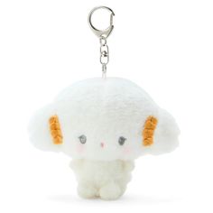 a white stuffed animal keychain with orange ears