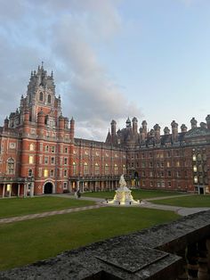 a large building with a fountain in front of it