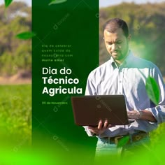 a man standing in front of a green screen holding a laptop computer and looking at the screen