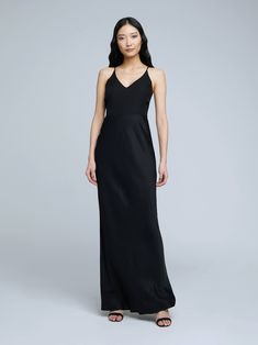 A stunning, understated maxi skirt in pure black. Bias-cut, silk-like fabric falls in a subtle, lustrous cling over the figure, enhancing and elongating the silhouette. Smooth elastic waist with no closures. Parisienne Chic, Pure Black, Black Fits, White Skirts, Winter Collection, Long Skirt, One Shoulder Formal Dress, Maxi Skirt, Elastic Waist