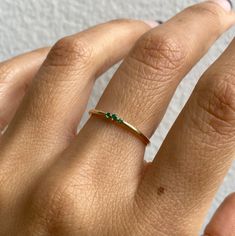 SWEETEST LITTLE TRIO WHAT IT IS: A trio of emeralds on a 14K gold ring WHY IT’S SPECIAL: It's the little things that adds the drama to your ring game Sweet and dainty, this delicate ring still packs a punch GOOD TO KNOW: 1.5 mm emerald Two 1.2mm emeralds WHY WE LOVE JENNIE KWON: Handmade in Los Angeles, all of Jennie Kwon’s pieces are ethically sourced. That means her gold is fair-mined, her stones are conflict-free, and you can shop with peace of mind. And did we mention we love everything she creates? Green Sapphire Necklace, Diamond Mirror, Jennie Kwon, Ring Game, Blue Sapphire Necklace, Braided Ring, Gemstone Engagement, Circle Diamond, Emerald Necklace