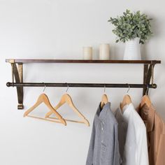 This innovative piece combines a clothing rod and floating shelf, offering ample storage and display space. Enhance your walk-in closet, bedroom, bathroom, or entryway with additional storage options. The wall brackets are designed for easy mounting on any flat surface. Crafted from solid Paulownia wood boards and powder-coated metal brackets, this floating shelf is a fantastic selection for showcasing collectibles, small plants, stuffed animals, and more, adding a touch of elegance and function Bracket Shelf, Paulownia Wood, Shelf Wood, Bar Black, Wood Boards, Hanging Bar, Bathroom Refresh, Bathtub Accessories, Display Shelf