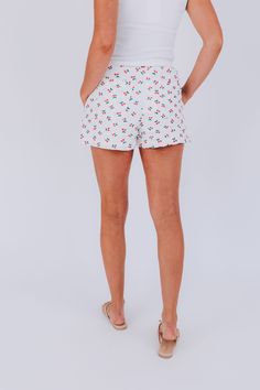 Fun, flirty, and comfortable - our Cherry Blush Shorts feature an elastic waistband and convenient back pockets. Perfect for a day out with friends or a casual summer adventure. Details Elastic waistband Back pockets Fully lined Sizing Approximate measurements: SIZE LENGTH/INSEAM WAIST Small 14/13" 28" Medium 14/13" 32" Large 14.5/13.5" 34" Fabric has stretch in the waistband Model is 5’10 wearing small Material Self 65% Polyester 35% RayonLining 100% Rayon Casual Short Bottoms For Summer, Cotton Pants With Built-in Shorts For Vacation, Summer Beachwear Bottoms With Pockets, Casual Pajama Shorts With Elastic Waistband For Beach Season, Beach Pants With Built-in Shorts, Relaxed Fit Bottoms For Summer Day Out, Summer Casual Loungewear Bottoms, Casual Beach Bottoms For Spring, Casual Spring Pajama Shorts